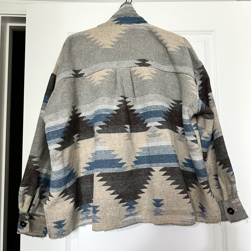 This is a beautiful warm jacket or laying piece over a dress.